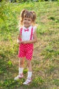 Little girl baby with tails in holiday clothes