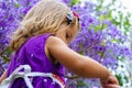 Little girl on the background of purple wood Royalty Free Stock Photo