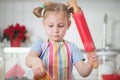 Little girl baking Christmas cookies at home Royalty Free Stock Photo