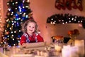 Little girl baking Christmas pastry. Royalty Free Stock Photo