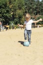 Little girl with ball on the beach Royalty Free Stock Photo