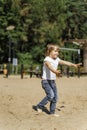 Little girl with ball on the beach