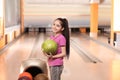 Little girl with ball in bowling Royalty Free Stock Photo