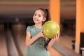 Little girl with ball in bowling Royalty Free Stock Photo