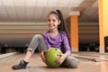 Little girl with ball in bowling Royalty Free Stock Photo