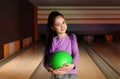 Little girl with ball in bowling Royalty Free Stock Photo