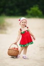 Little girl with basket full of strawberries Royalty Free Stock Photo