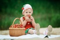 Little girl with basket full of strawberries Royalty Free Stock Photo