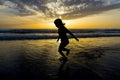 Little girl bathing on the beach at dusk Royalty Free Stock Photo