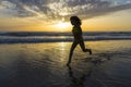 Little girl bathing on the beach at dusk Royalty Free Stock Photo