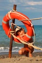 Little girl in bathing suit standing on beach Royalty Free Stock Photo