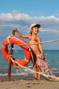 Little girl in bathing suit standing on beach Royalty Free Stock Photo