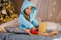 Little girl in bathrobe. Christmas Royalty Free Stock Photo