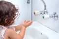 Child washing hand with water.To keep the flu virus at bay, wash your hands with soap and water several times a day. Royalty Free Stock Photo