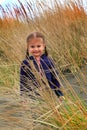 Little girl in beach grass Royalty Free Stock Photo