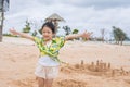 Little girl at beach making sand castle Royalty Free Stock Photo