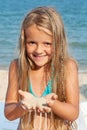 Little girl on the beach playing with sand Royalty Free Stock Photo