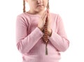Little girl with beads praying on white background Royalty Free Stock Photo