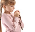 Little girl with beads praying on white background Royalty Free Stock Photo