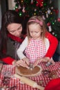 Little girl with beautiful mother baking Christmas Royalty Free Stock Photo