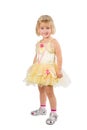 Little girl in a beautiful yellow dress and crown on white back Royalty Free Stock Photo