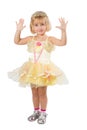 Little girl in a beautiful yellow dress and crown on white back Royalty Free Stock Photo