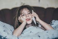Little girl speaking by cell phone Royalty Free Stock Photo