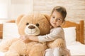 Little girl in bed with teddy bear Royalty Free Stock Photo