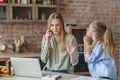 Little girl begging her overworking mom for attention Royalty Free Stock Photo