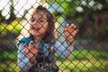 Little girl behind a fence Royalty Free Stock Photo