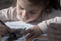 Little girl being drawing on celebrating child`s day, in a park in Trinidad Royalty Free Stock Photo