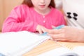 Little girl being taught writing and reading