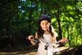 Little girl with bicycle in summer park outdoors Royalty Free Stock Photo