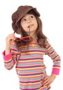 Little girl in big brown hat and with sunglasses Royalty Free Stock Photo