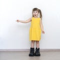 Little girl in big daddy boots