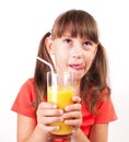 Little girl with a big glass of juice Royalty Free Stock Photo