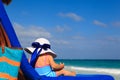 Little girl in big hat on summer beach Royalty Free Stock Photo