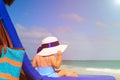 Little girl in big hat on summer beach Royalty Free Stock Photo