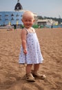 Little girl and big sandals Royalty Free Stock Photo