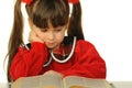 The little girl before the big scientific book Royalty Free Stock Photo