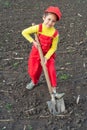 Little girl with big shovel Royalty Free Stock Photo