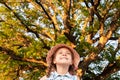 Huge Tree. a little girl by a big tree. child near with large green old oak Royalty Free Stock Photo