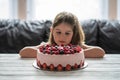 Little girl birthday cake.Home made cake with berries. Cake with Strawberry, blackberry, blueberry, and raspberry on a table Royalty Free Stock Photo