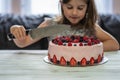 Little girl birthday cake.Home made cake with berries. Cake with Strawberry, blackberry, blueberry, and raspberry on a table Royalty Free Stock Photo