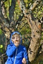 Little girl biting apple in the garden. Royalty Free Stock Photo