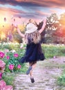 A little girl in a black airy dress and hat jumps with joy Royalty Free Stock Photo