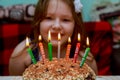 Little girl blowing candles Birthday cake with candles Royalty Free Stock Photo