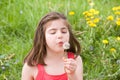 Little Girl Blowing Dandelion Seeds Royalty Free Stock Photo