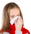 Little girl blowing her nose in a great effort Royalty Free Stock Photo