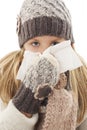 Little girl blowing her nose. Winter style. Royalty Free Stock Photo